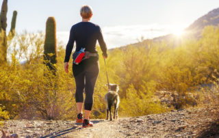 woman hiking with pet