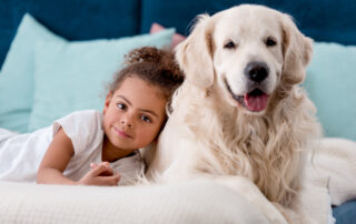 small child with white lab